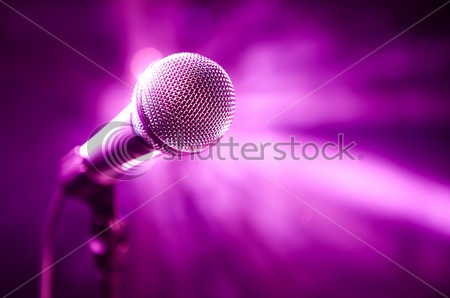 stock photo microphone on stage with purple background 52217536